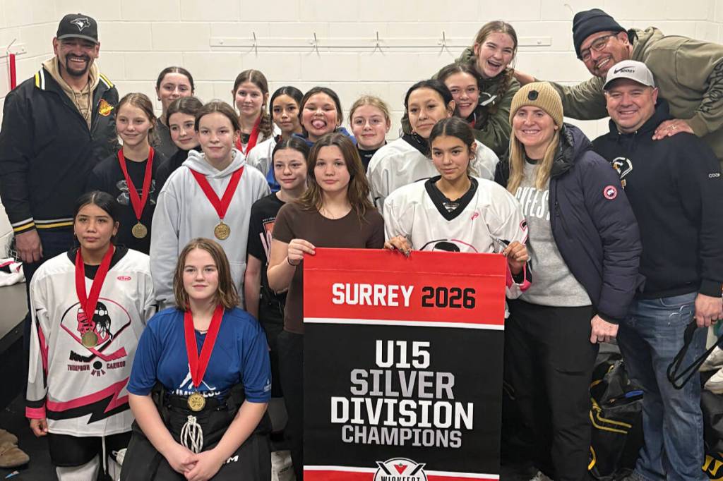 The gold medal-winning Ashcroft U15 girls&rsquo; hockey team with hockey legend Hayley Wickenheiser at WickFest 2026. (back row from l) Coach Kyle Minnabarriet, Lyrik Kaczkowski, Leah Klapstein, Grace Bergen (in front of Kyle and Lyrik), Ayda Schmitz, Ava Charters, Rowen Minnabarriet, Ashley Cameron, Rya Minnabarriet, Carly Schalles (on Rya&rsquo;s back), Devnn Shackelly (kneeling), Selene Ball (in front of Ayda and Ava), Addi Zabaras, Mariah Minnabarriet, Sadie Spencer (beside banner), Marina Symes, River Billy, Hayley Wickenheiser, coaches Ryan Minnabarriet and Kris Billy (behind Ryan). (Spotted Fawn Minnabarriet)